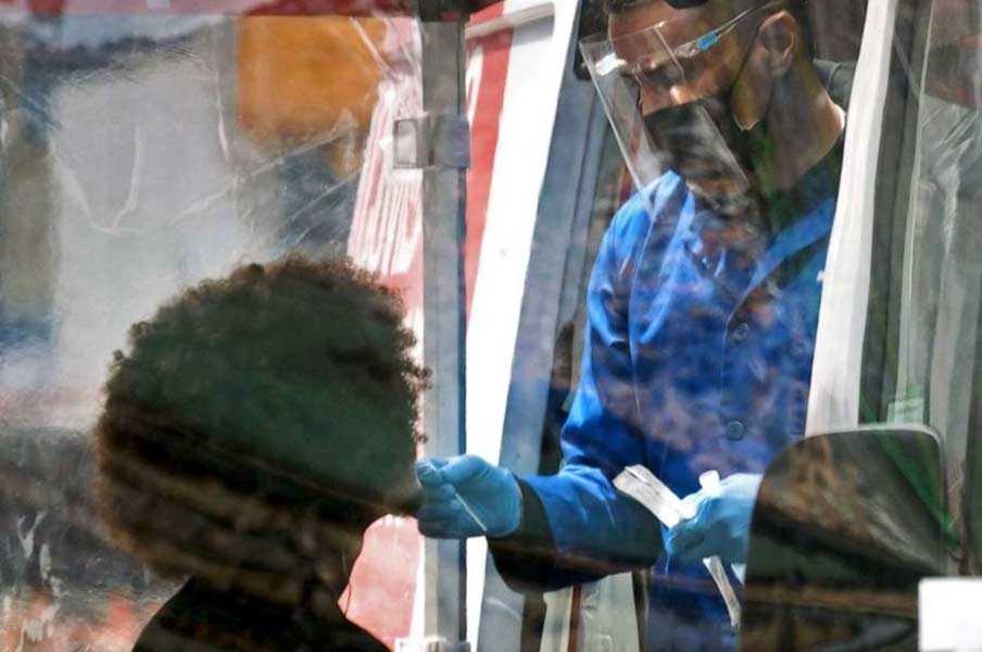 Spencer Platt/Getty Images. A person is tested at a Covid-19 testing van in Times Square on May 3, 2022 in New York City.